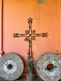 Crucifix beside millstones.