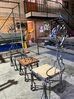 Chess table and chairs in the workshop.