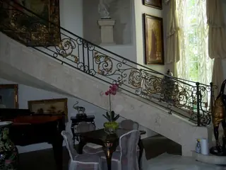 Staircase with ornamental railing.