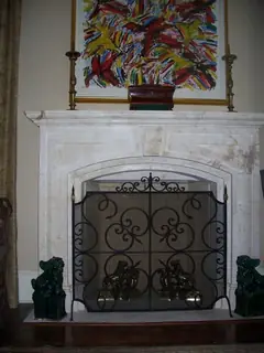 Screen beneath the mantel.