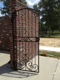 Garden gate in a brick wall.