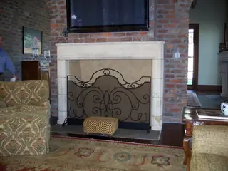 Scrollwork screen with an arched top.