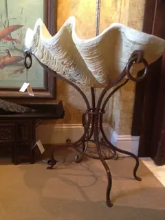 Iron stand with a bowl.