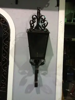 Wall lantern with scrollwork.