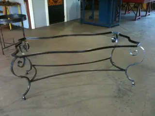 Table frame with curved legs.
