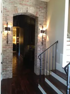 Hall with door, stairs and lanterns.