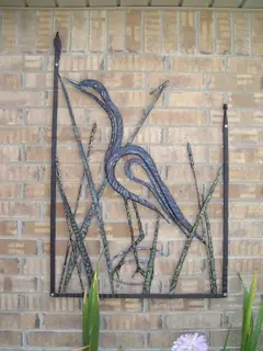 Wall panel with a bird.