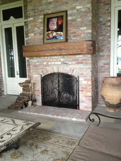 Screen in a brick fireplace.