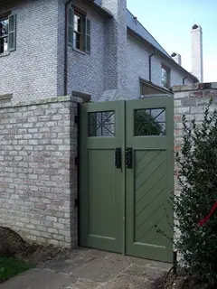 Green gate with iron fittings.