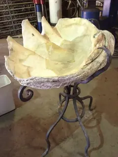Bowl on a three-legged stand.