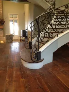 Staircase foot with scrollwork.