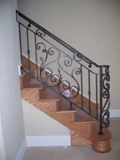Scrollwork by the first steps.
