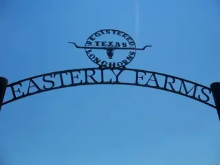 Arch bearing the EASTERLY FARMS sign.