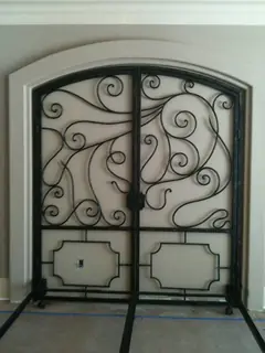 Double doors with large scrolls.
