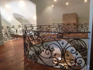 Curved railing seen from above.