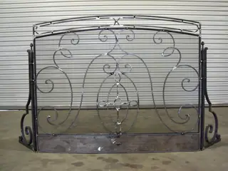 Ornamental panel leaning against a wall.