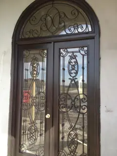 Glass door with ornamental ironwork.
