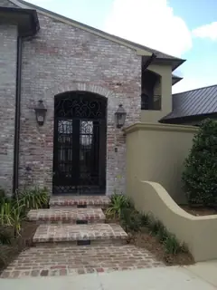 Arched entrance in a stone wall.