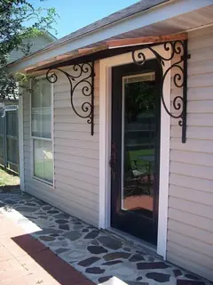 Scrollwork brackets beneath the eaves.
