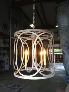 Pendant light formed from rings.