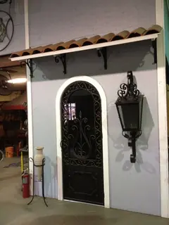 Arched door beside a lantern.