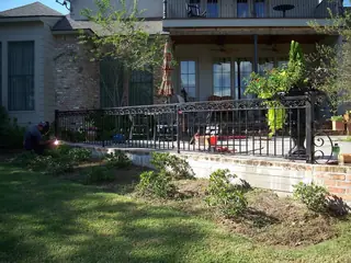 Railing in front of a porch.