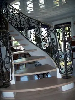 Curved staircase with scrolls in backlight.