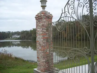 Gate detail beside water.