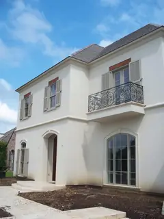 Balcony on a pale facade.
