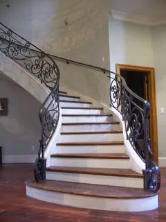 Curved stairs with wooden treads.