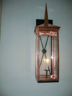 Tall lantern with a pointed finial.