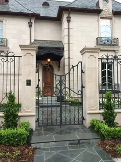 Entrance with gate and enclosure.