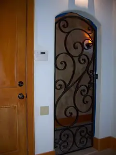 Detail of a door with scrollwork.