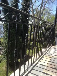 Long railing beside a terrace.