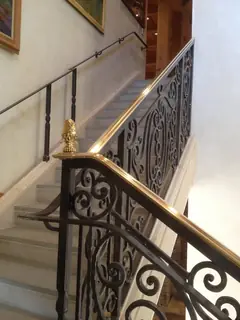 Railing with a wooden handrail.
