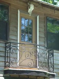 Small balcony on a timber facade.