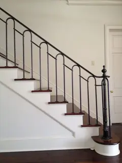 Stairs with a small-arched railing.