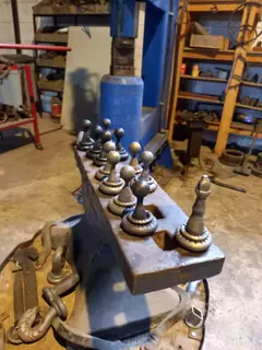 Chess pieces on the anvil.